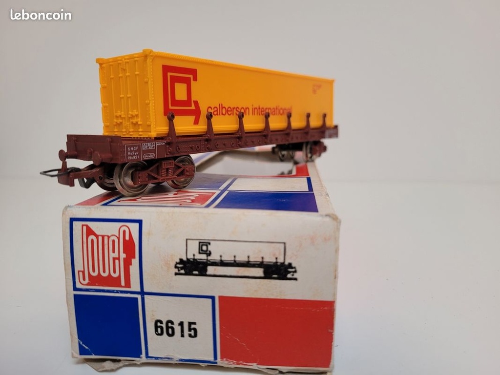 Train wagon N°6615 Wagon plat à ranchers à bogies TP avec chargement d'un conteneur CALBERSON Jouef Ho
